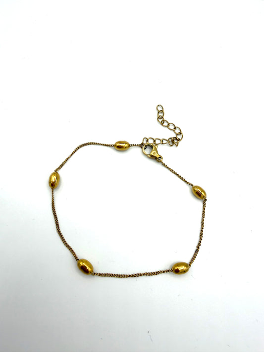 Armband met gouden ovalen balletjes