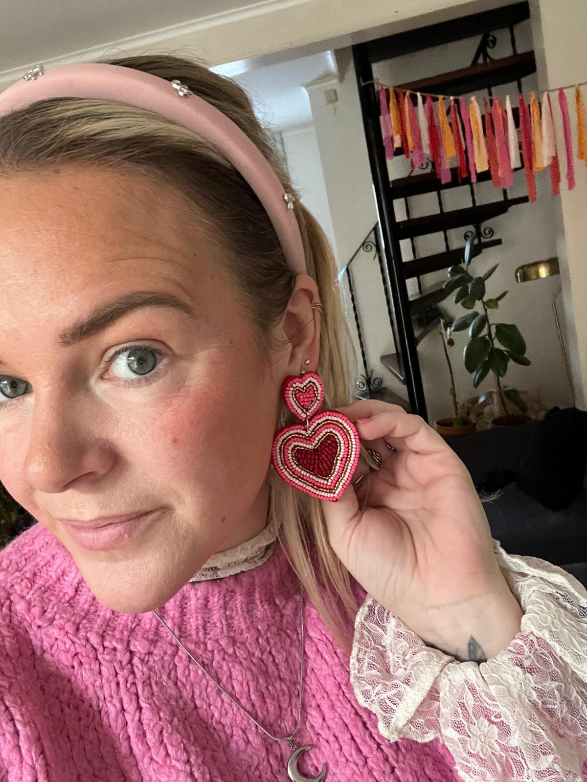 Lichtroze haarband met strikjes