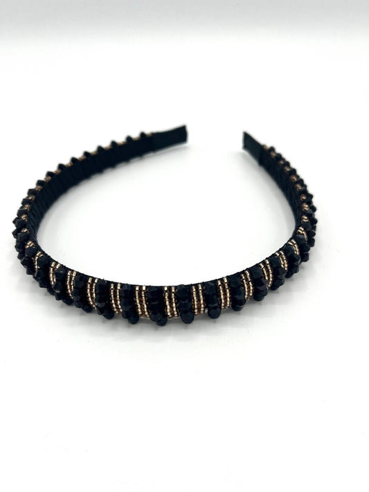 Smalle zwarte haarband met gouden sprankelende kralen