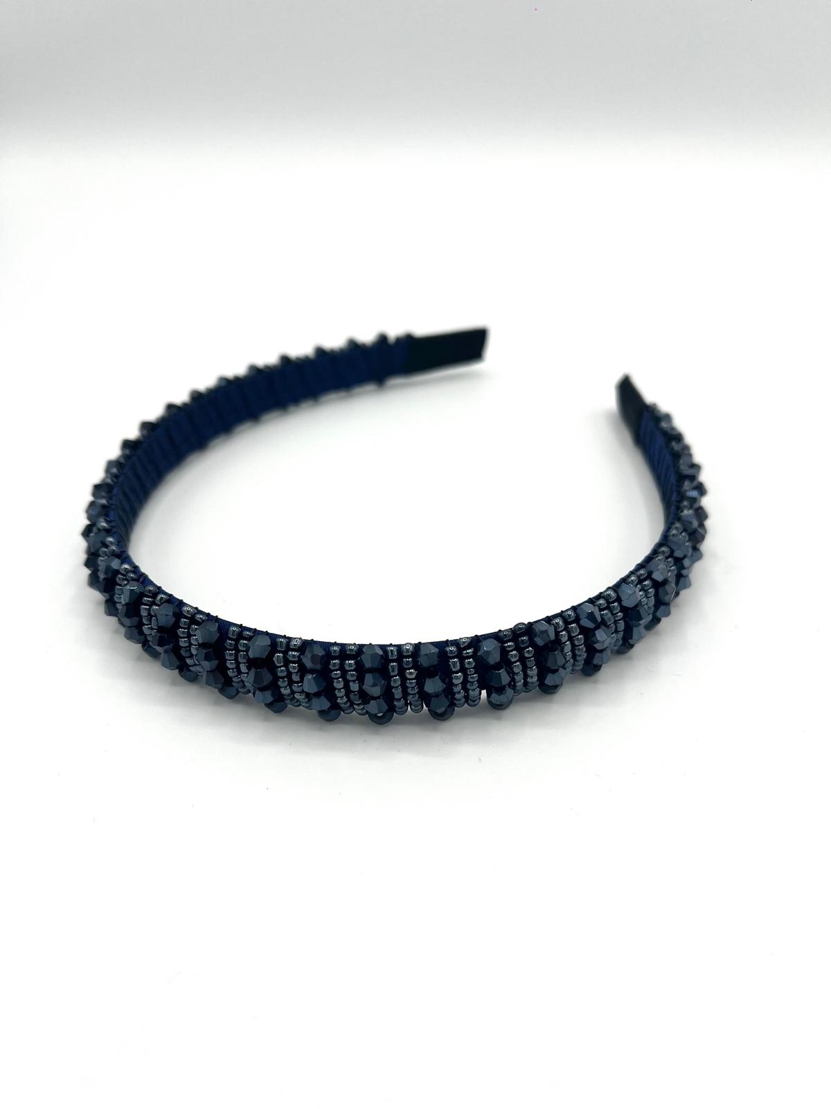 Smalle blauwe haarband met sprankelende kralen