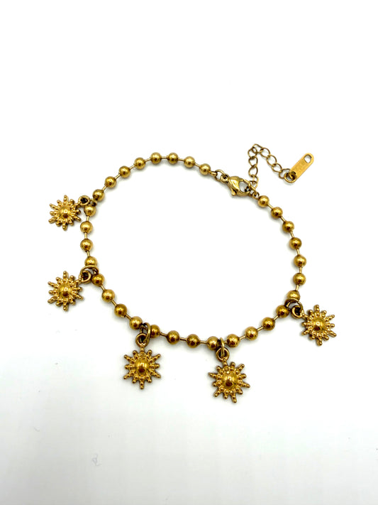 Goudkleurige armband met zonnetjes