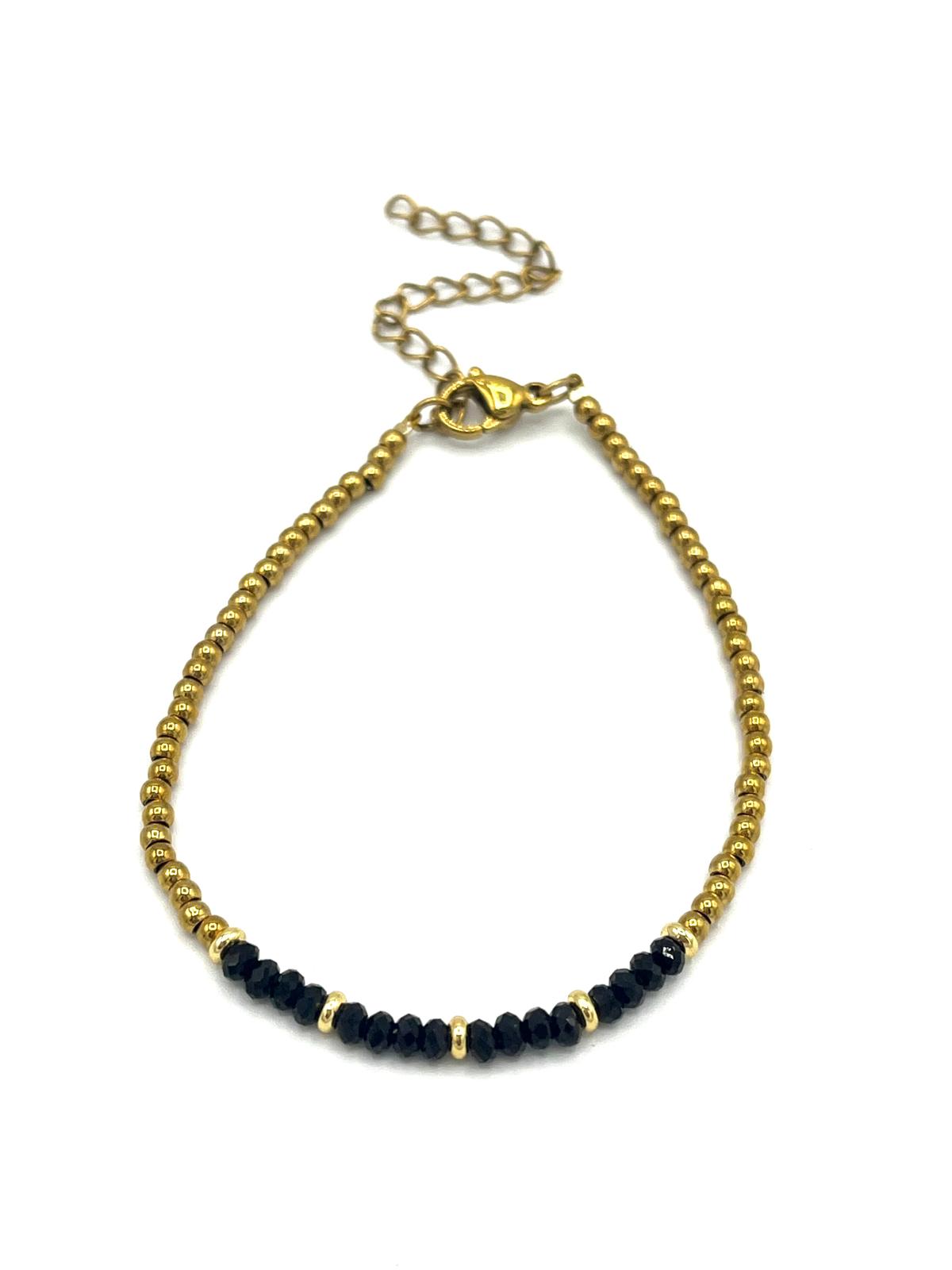 Zwarte onyx armband met gouden details