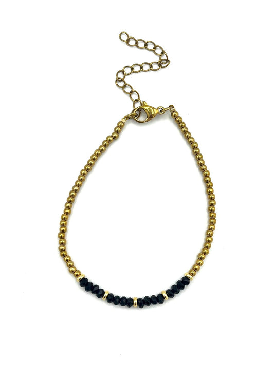 Zwarte onyx armband met gouden details