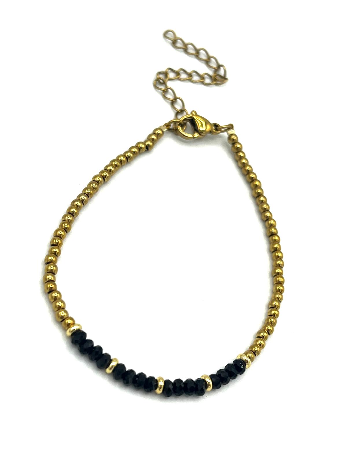 Zwarte onyx armband met gouden details