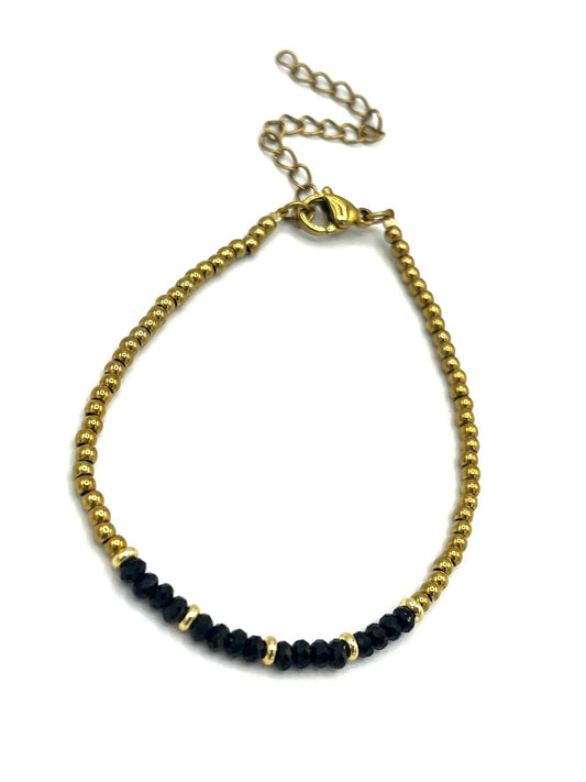 Zwarte onyx armband met gouden details