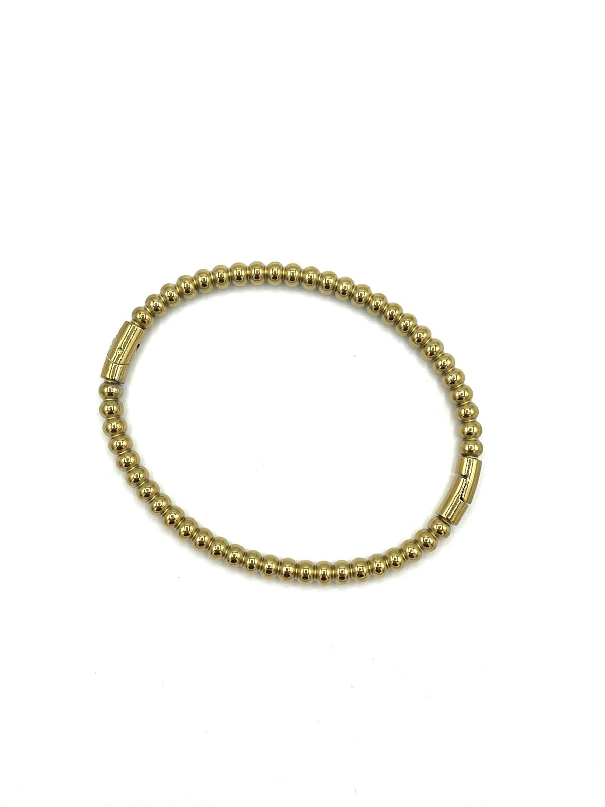 Bangle goudkleurig met balletjes.