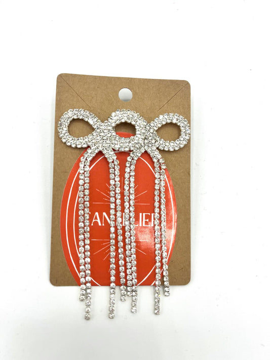 Grote strik oorbellen met zilveren strass stenen