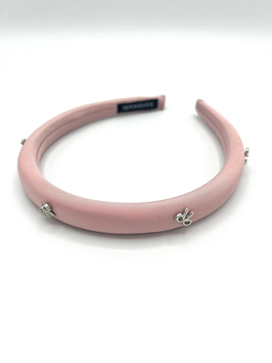 Lichtroze haarband met strikjes