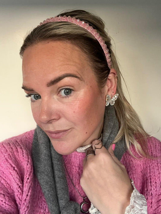 Smalle roze haarband met sprankelende kralen