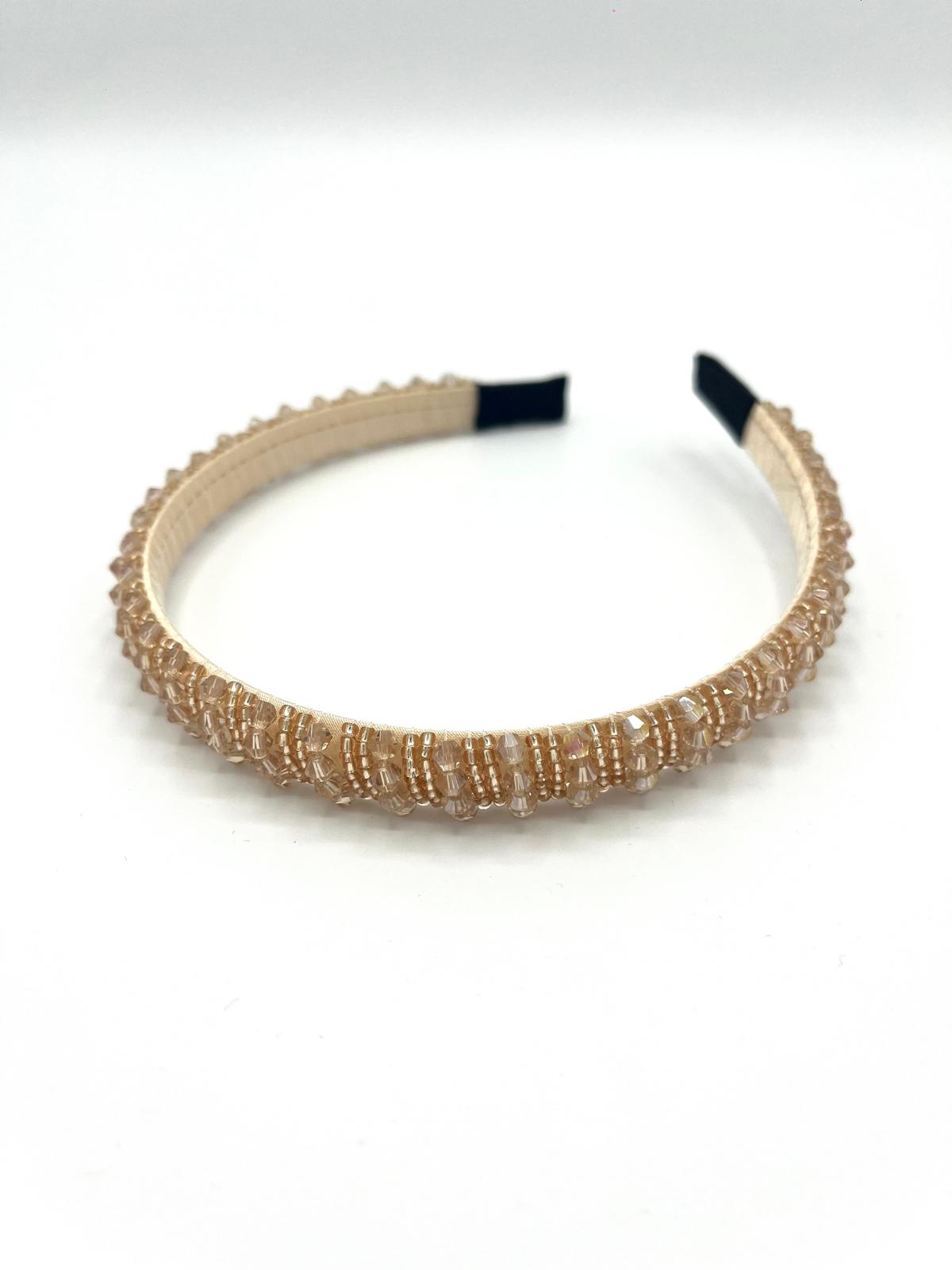 Smalle champagne haarband met sprankelende kralen