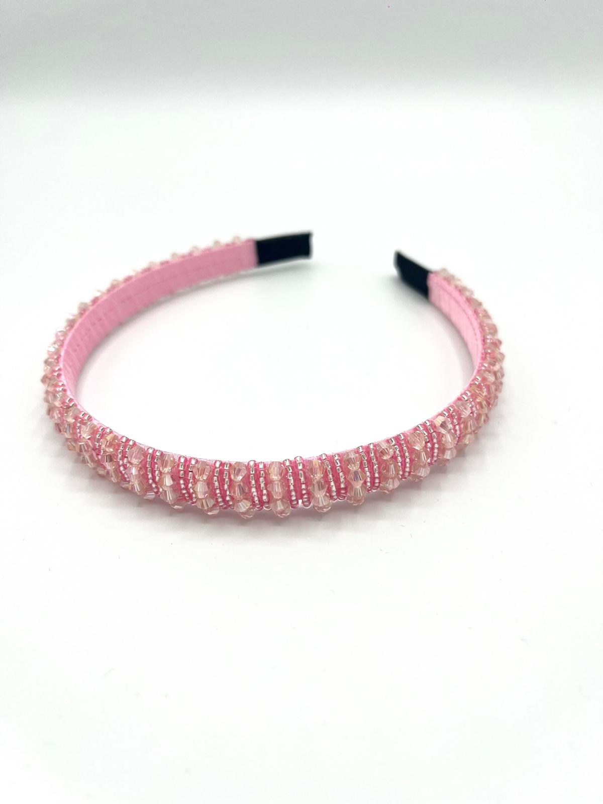 Smalle roze haarband met sprankelende kralen