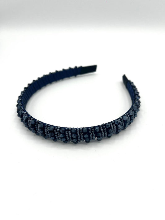 Smalle blauwe haarband met sprankelende kralen